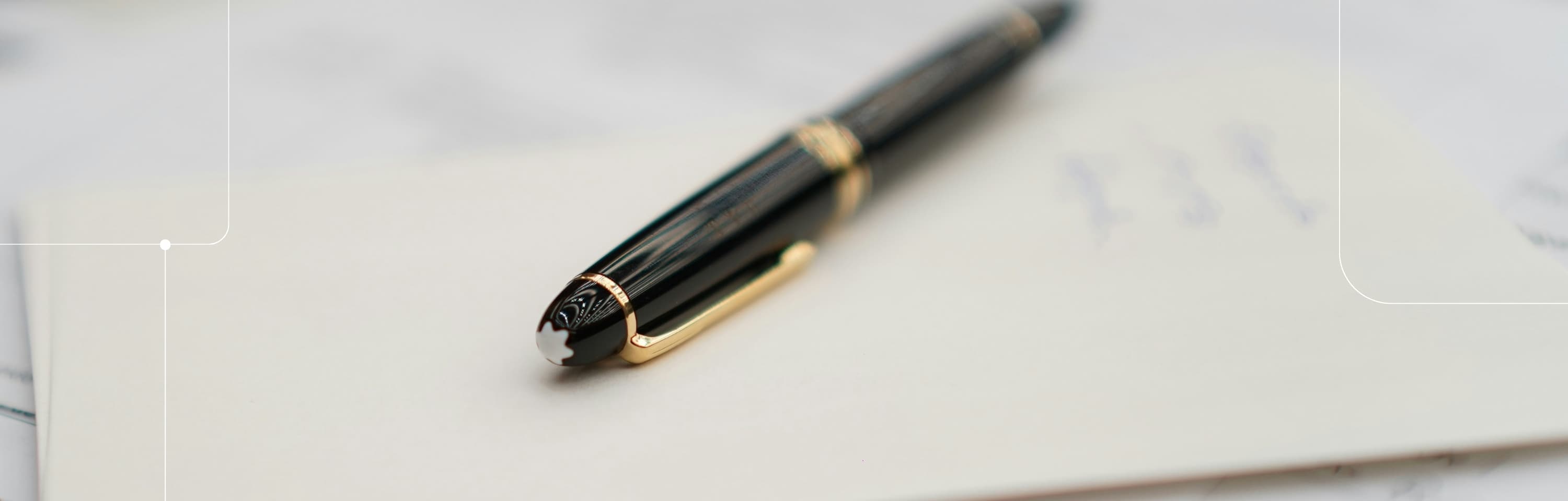 Pen resting on an open notebook